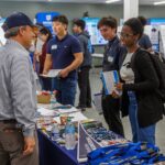 Students and faculty discussing graduate school opportunities